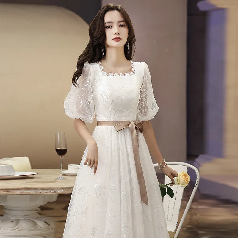Lace Dress With Puff Sleeves And Bow