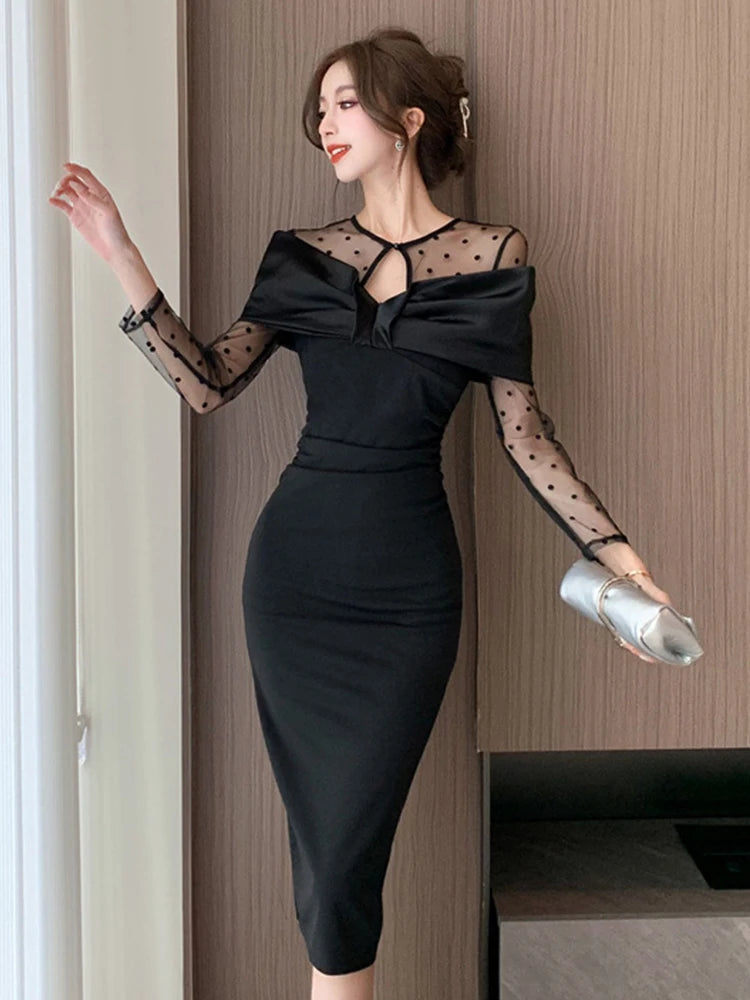 black dress with sheer polka dot sleeve 1960s Black Mini Dress With Sheer Polka Dot Sleeves
