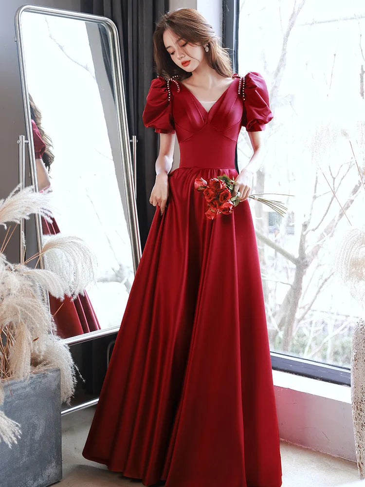 red satin puff sleeve dress Red Satin Gown With Puff Sleeves Detail