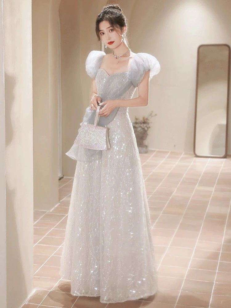 Sparkling Silver Gown With Puffy Sheer Sleeves